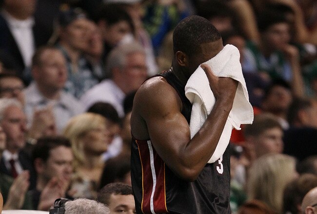 BOSTON - APRIL 27:  Dwyane Wade #3 of the Miami Heat waits near the scorer's table as Ray Allen of the Boston Celtics shoots three free throws during Game Five of the Eastern Conference Quarterfinals of the 2010 NBA playoffs at the TD Garden on April 27, 2010 in Boston, Massachusetts. The Celtics defeated the Heat 96-86 to win the series. NOTE TO USER: User expressly acknowledges and agrees that, by downloading and or using this photograph, User is consenting to the terms and conditions of the Getty Images License Agreement.  (Photo by Elsa/Getty Images)