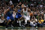 BOSTON - MAY 28:  Paul Pierce #34 of the Boston Celtics drives in the post against Matt Barnes #22 and Rashard Lewis #9 of the Orlando Magic in Game Six of the Eastern Conference Finals during the 2010 NBA Playoffs at TD Garden on May 28, 2010 in Boston, Massachusetts.  NOTE TO USER: User expressly acknowledges and agrees that, by downloading and/or using this Photograph, user is consenting to the terms and conditions of the Getty Images License Agreement.  (Photo by Jim Rogash/Getty Images)