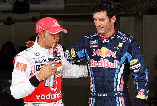 ISTANBUL, TURKEY - MAY 29:  Pole sitter Mark Webber (R) of Australia and Red Bull Racing celebrates in parc ferme with second placed Lewis Hamilton (L) of Great Britain and McLaren Mercedes after qualifying for the Turkish Formula One Grand Prix at Istanbul Park on May 29, 2010, in Istanbul, Turkey.  (Photo by Malcolm Griffiths/Getty Images)