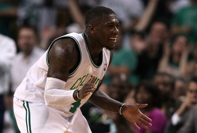 BOSTON - MAY 28:  Nate Robinson #4 of the Boston Celtics celebrates after he scored a basket in the second quarter against the Orlando Magic in Game Six of the Eastern Conference Finals during the 2010 NBA Playoffs at TD Garden on May 28, 2010 in Boston, Massachusetts.  NOTE TO USER: User expressly acknowledges and agrees that, by downloading and/or using this Photograph, user is consenting to the terms and conditions of the Getty Images License Agreement.  (Photo by Elsa/Getty Images)