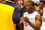 SYRACUSE, NY - MARCH 27:  Eric Bledsoe #24 and Darius Miller #1 of the Kentucky Wildcats and his teammates congratulate the West Virginia Mountaineers on West Virginia's 73-66 win during the east regional final of the 2010 NCAA men's basketball tournament at the Carrier Dome on March 27, 2010 in Syracuse, New York.  (Photo by Chris Chambers/Getty Images)