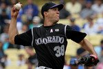 LOS ANGELES, CA - MAY 09:  Ubaldo Jimenez #38 of the Colorado Rockies pitches against the Los Angeles Dodgers in the second inning at Dodger Stadium on May 9, 2010 in Los Angeles, California.  (Photo by Jeff Gross/Getty Images)
