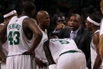 BOSTON - MAY 28:  Head coach Doc Rivers of the Boston Celtics talks with his players during a timeout against the Orlando Magic in Game Six of the Eastern Conference Finals during the 2010 NBA Playoffs at TD Garden on May 28, 2010 in Boston, Massachusetts.  NOTE TO USER: User expressly acknowledges and agrees that, by downloading and/or using this Photograph, user is consenting to the terms and conditions of the Getty Images License Agreement.  (Photo by Jim Rogash/Getty Images)