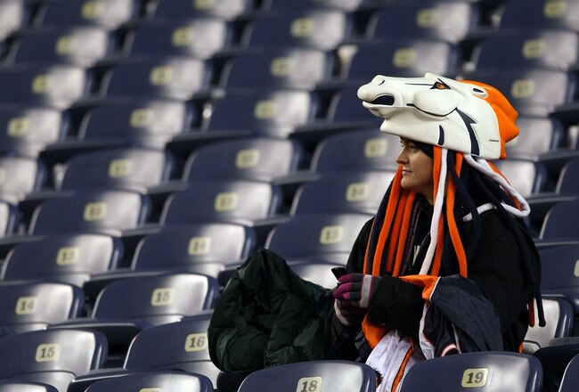 DENVER - JANUARY 03: A Broncos fan sits in the seats following the Denver Broncos defeat by the Kansas City Chiefs during NFL action at Invesco Field at Mile High on January 3, 2010 in Denver, Colorado. (Photo by Doug Pensinger/Getty Images)