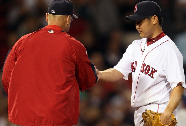 BOSTON - MAY 27:  Manager Terry Francona #47 of the Boston Red Sox pulls pitcher Daisuke Matsuzaka #18 in the fifth inning against the Kansas City Royals on May 27, 2010 at Fenway Park in Boston, Massachusetts.  (Photo by Elsa/Getty Images)