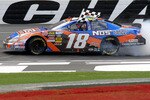 CONCORD, NC - MAY 29:  Kyle Busch, driver of the #18 NOS Energy Drink Toyota, celebrates on track after winning the NASCAR Nationwide Series Tech-Net Auto Service 300 at Charlotte Motor Speedway on May 29, 2010 in Concord, North Carolina.  (Photo by Tom Whitmore/Getty Images for NASCAR)