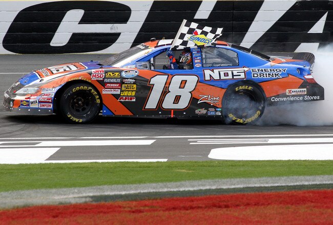 CONCORD, NC - MAY 29:  Kyle Busch, driver of the #18 NOS Energy Drink Toyota, celebrates on track after winning the NASCAR Nationwide Series Tech-Net Auto Service 300 at Charlotte Motor Speedway on May 29, 2010 in Concord, North Carolina.  (Photo by Tom Whitmore/Getty Images for NASCAR)