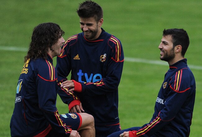 SCHRUNS, AUSTRIA - MAY 31:  Carles Puyol (L) of Spain jokes with his teammates Gerard Pique (C) and Cesc Fabregas during a training session on May 31, 2010 in Schruns, Austria.  (Photo by Jasper Juinen/Getty Images)
