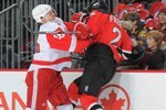 NEWARK, NJ - DECEMBER 5: Kirk Maltby #18 of the Detroit Red Wings checks Mark Fraser #2 of the New Jersey Devils during the third period on December 5, 2009 at the Prudential Center in Newark, New Jersey. (Photo by Christopher Pasatieri/Getty Images)