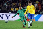 JOHANNESBURG, SOUTH AFRICA - JUNE 25: Kagisho Dikgacoi of South Africa and Kaka of Brazil compete during the 2009 Confederations Cup semi-final match between South Africa and Brazil at Ellis Park on June 25, 2009 in Johannesburg, South Africa. (Photo by Lefty Shivambu/Gallo Images/Getty Images)