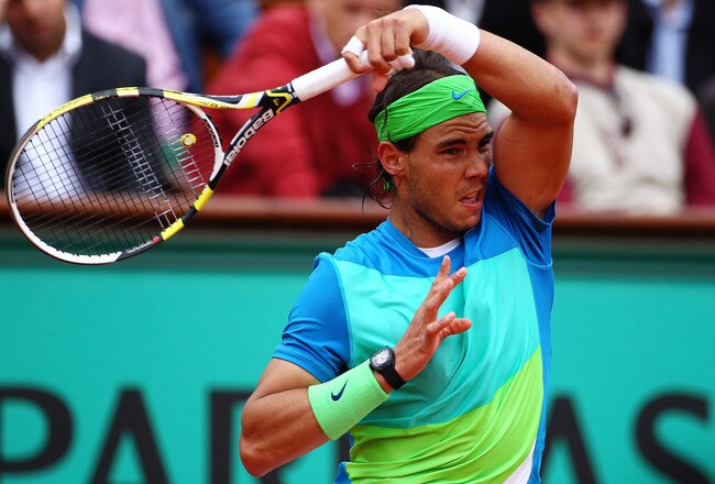 PARIS - MAY 31:  Rafael Nadal of Spain plays a backhand during the men's singles fourth round match between Rafael Nadal of Spain and Thomaz Bellucci of Brazil at the French Open on day nine of the French Open at Roland Garros on May 31, 2010 in Paris, France.  (Photo by Clive Brunskill/Getty Images)