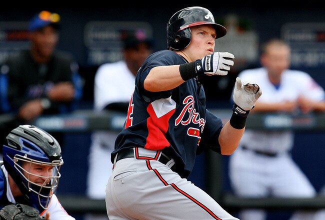 PORT ST. LUCIE, FL - MARCH 02:  Outfielder Nate McLouth #24 of the Atlanta Braves reacts as he lets go of his bat while swinging at a pitch against the New York Mets at Tradition Field on March 2, 2010 in Port St. Lucie, Florida.  (Photo by Doug Benc/Getty Images)