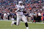 DENVER - DECEMBER 20:  Michael Bush #29 of the Oakland Raiders carries the ball into the endzone for a touchdown against the Denver Broncos at Invesco Field at Mile High on December 20, 2009 in Denver, Colorado.  (Photo by Jeff Gross/Getty Images)