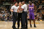 LOS ANGELES, CA - APRIL 28:  Tim Thomas #2 (R) of the Phoenix Suns looks in on referees (L-R) Tim Donaghy #21, Bill Spooner #22 and Eddie F. Rush as they discuss the proper call on a play where Thomas was flagrantly fouled by Luke Walton #4 of the Los Angeles Lakers in Game Three of the Western Conference Quarterfinals during the 2006 NBA Playoffs April 28, 2006 at Staples Center in Los Angeles, California. Boris Diaw of the Phoenix SUns was called for a technical foul for his actions after the play.  (Photo by Lisa Blumenfeld/Getty Images)