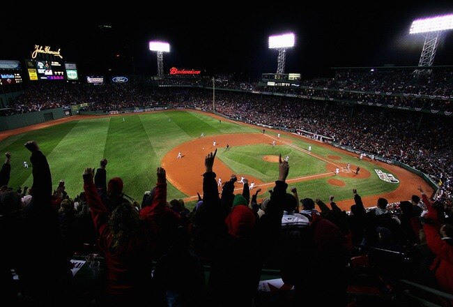BOSTON - OCTOBER 13:  The crowd cheers as Mike Lowell #25 of the Boston Red Sox hits a two RBI single in the third inning during Game Two of the American League Championship Series against the Cleveland Indians at Fenway Park on October 13, 2007 in Boston, Massachusetts.  (Photo by Al Bello/Getty Images)