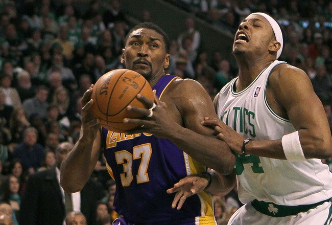 BOSTON - JANUARY 31:  Ron Artest #37 of the Los Angeles Lakers drives toward the basket against the defense of Paul Pierce #34 of the Boston Celtics at the TD Garden on January 31, 2010 in Boston, Massachusetts.  The Lakers won 90-89. NOTE TO USER: User expressly acknowledges and agrees that, by downloading and or using this photograph, User is consenting to the terms and conditions of the Getty Images License Agreement. (Photo by Jim Rogash /Getty Images)
