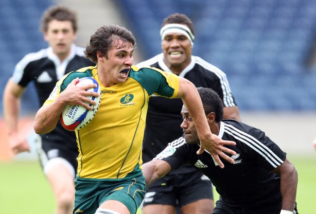 EDINBURGH, SCOTLAND -  MAY 30: Nick Phipps of Australia  races towards the try line persued by Lote Raikabula during the match between Australia and New Zealand during the the IRB Edinburgh Sevens Festival at Murrayfield Stadium on May 30, 2010 in Edinburgh, Scotland. (Photo by Ian MacNicol/Getty Images)