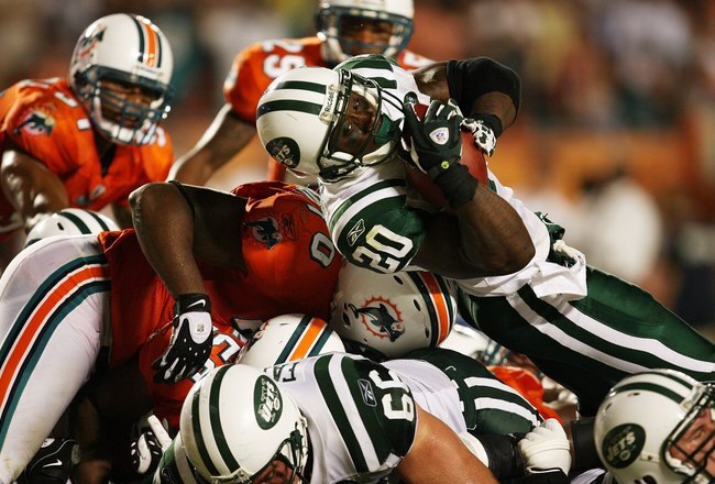 MIAMI - OCTOBER 12:  Running back Thomas Jones #20 of the New York Jets scores a touchdown against the Miami Dolphins at Land Shark Stadium on October 12, 2009 in Miami, Florida. The Dolphins defeated the Jets 31-27.  (Photo by Doug Benc/Getty Images)