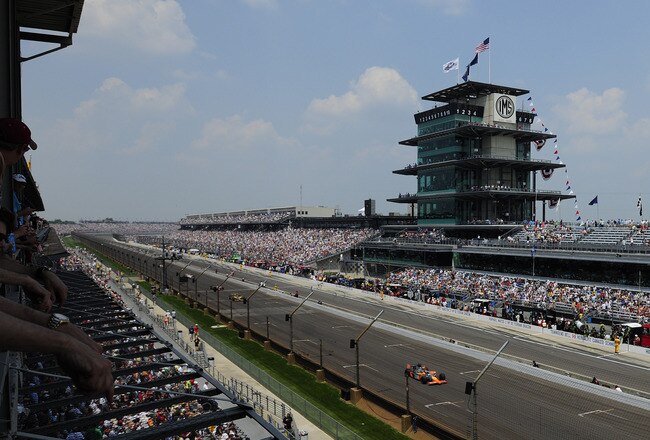 INDIANAPOLIS - MAY 30:  Mario Romancini of Brazil, driver of the #34 Conquest Racing Dallara Honda, and Scott Dixon of New Zealand, driver of the #9 Target Chip Ganassi Racing Dallara Honda lead a pack of cars during the IZOD IndyCar Series 94th running of the Indianapolis 500 at the Indianapolis Motor Speedway on May 30, 2010 in Indianapolis, Indiana.  (Photo by Robert Laberge/Getty Images)
