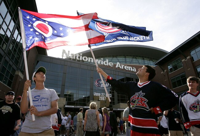 COLUMBUS, OH - JUNE 22:  Fans of the Columbus Blue Jackets wave flags prior to first round of the 2007 NHL Entry Draft outside of Nationwide Arena on June 22, 2007 in Columbus, Ohio.  (Photo by Jamie Sabau/Getty Images)