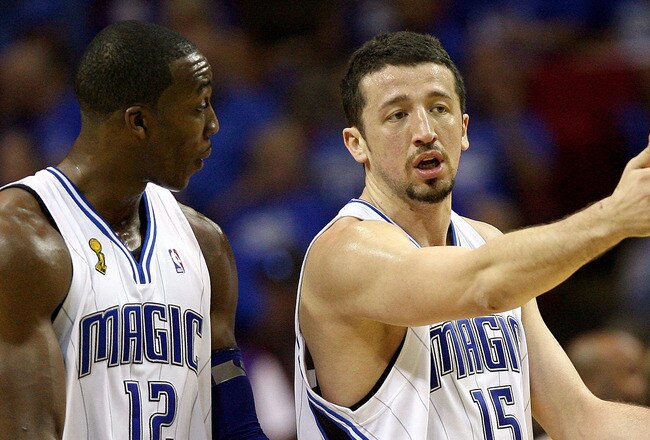 ORLANDO, FL - JUNE 14:  Dwight Howard #12 talks to Hedo Turkolgu #15 of the Orlando Magic as they walk across the court in the first half against the Los Angeles Lakers in Game Five of the 2009 NBA Finals on June 14, 2009 at Amway Arena in Orlando, Florida.  NOTE TO USER:  User expressly acknowledges and agrees that, by downloading and or using this photograph, User is consenting to the terms and conditions of the Getty Images License Agreement.  (Photo by Elsa/Getty Images)