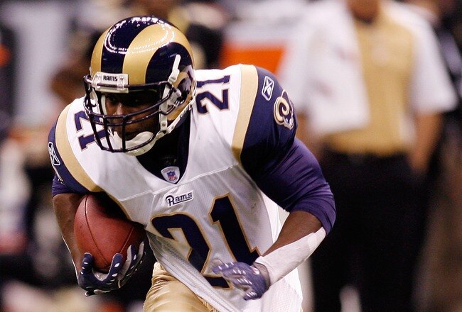 NEW ORLEANS - NOVEMBER 11:  Oshiomogho Atogwe #21 of the St. Louis Rams is tackled by David Patten #81 of the New Orleans Saints after making an interception on November 11, 2007 at the Louisiana Superdome in New Orleans, Louisiana.  (Photo by Chris Graythen/Getty Images)