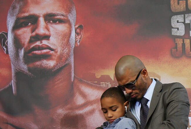 NEW YORK - JUNE 02:  Miguel Cotto and his son Miguel Jr. look on prior to the start of the Foreman v Cotto press conference on June 2, 2010 at Yankee Stadium in the Bronx borough of New York City.  (Photo by Mike Stobe/Getty Images)