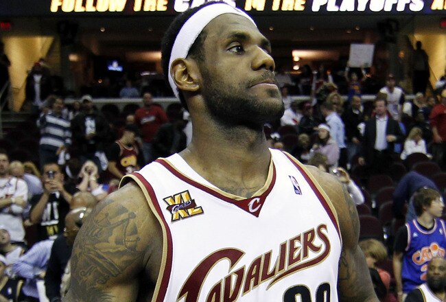 CLEVELAND - MAY 11:  LeBron James #23 of the Cleveland Cavaliers untucks his jersey after being defeated 120-88 by the Boston Celtics in Game Five of the Eastern Conference Semifinals during the 2010 NBA Playoffs at Quicken Loans Arena on May 11, 2010 in Cleveland, Ohio.  NOTE TO USER: User expressly acknowledges and agrees that, by downloading and or using this photograph, User is consenting to the terms and conditions of the Getty Images License Agreement.  (Photo by Gregory Shamus/Getty Images)