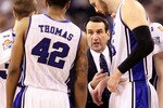 INDIANAPOLIS - APRIL 05:  Head coach Mike Krzyzewski of the Duke Blue Devils talks with Brian Zoubek #55 and Lance Thomas #42 during a timeout against the Butler Bulldogs during the 2010 NCAA Division I Men's Basketball National Championship game at Lucas Oil Stadium on April 5, 2010 in Indianapolis, Indiana. Duke won 61-59.  (Photo by Andy Lyons/Getty Images)