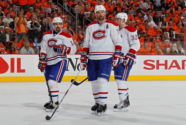 PHILADELPHIA - MAY 24:  Tomas Plekanec #14, Hal Gill #75 and Travis Moen #32 of the Montreal Canadiens look on against the Philadelphia Flyers in Game 5 of the Eastern Conference Finals during the 2010 NHL Stanley Cup Playoffs at Wachovia Center on May 24, 2010 in Philadelphia, Pennsylvania.  (Photo by Jim McIsaac/Getty Images)
