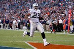 DENVER - DECEMBER 20:  Michael Bush #29 of the Oakland Raiders carries the ball into the endzone for a touchdown against the Denver Broncos at Invesco Field at Mile High on December 20, 2009 in Denver, Colorado.  (Photo by Jeff Gross/Getty Images)