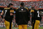 MIAMI - JANUARY 03:  Quarterbacks Ben Roethlisberger #7, Charlie Batch #16 and Dennis Dixon #2 of the Pittsburgh Steelers talk on the sidelines while taking on the Miami Dolphins at Land Shark Stadium on January 3, 2010 in Miami, Florida. The Steelers defeated the Dolphins 30-24.  (Photo by Doug Benc/Getty Images)