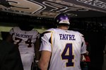 NEW ORLEANS - JANUARY 24:  Bryant McKinnie #74 and  Brett Favre #4 of the Minnesota Vikings walk off the field after the Vikings lost to the New Orleans Saints 31-28 in overtime during the NFC Championship Game at the Louisiana Superdome on January 24, 2010 in New Orleans, Louisiana.  (Photo by Jed Jacobsohn/Getty Images)