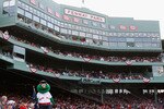 BOSTON - OCTOBER 13:  The Boston Red Sox mascot, Wally the Green Monster stands on the dugout inbetween innings of game three of the American League Championship Series against the Tampa Bay Rays during the 2008 MLB playoffs at Fenway Park on October 13, 2008 in Boston, Massachusetts.  (Photo by Jim Rogash/Getty Images)