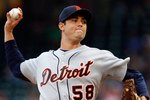 ARLINGTON, TX - JULY 27:  Pitcher Armando Galarraga #58 of the Detroit Tigers throws against the Texas Rangers on July 27, 2009 at Rangers Ballpark in Arlington, Texas.  (Photo by Ronald Martinez/Getty Images)