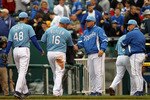 KANSAS CITY, MO - MAY 16:  Manager Ned Yost #2 of the Kansas City Royals congratulates players after the Royals defeated the Chicago White Sox 5-3 on May 16, 2010 at Kauffman Stadium in Kansas City, Missouri.  (Photo by Jamie Squire/Getty Images)