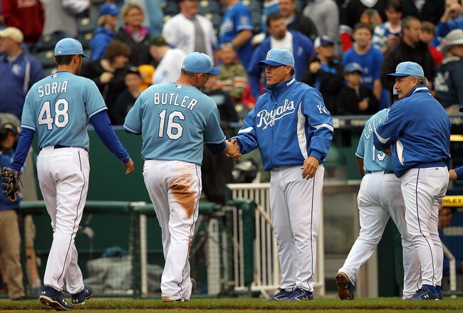 KANSAS CITY, MO - MAY 16:  Manager Ned Yost #2 of the Kansas City Royals congratulates players after the Royals defeated the Chicago White Sox 5-3 on May 16, 2010 at Kauffman Stadium in Kansas City, Missouri.  (Photo by Jamie Squire/Getty Images)