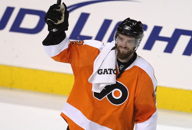 PHILADELPHIA - JUNE 02:  Ville Leino #22 of the Philadelphia Flyers celebrates after teammate Claude Giroux #28 scored the game-winning goal in overtime to defeat the Chicago Blackhawks 4-3 in Game Three of the 2010 NHL Stanley Cup Final at Wachovia Center on June 2, 2010 in Philadelphia, Pennsylvania.  (Photo by Al Bello/Getty Images)