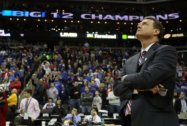 KANSAS CITY, MO - MARCH 13:  Head coach Bill Self of the Kansas Jayhawks watches highlights on the videoboard after the Jayhawks defeated the Kansas State Wildcats to win the 2010 Phillips 66 Big 12 Men's Basketball Championship on March 13, 2010 at the Sprint Center in Kansas City, Missouri.  (Photo by Jamie Squire/Getty Images)