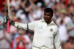 MANCHESTER, ENGLAND - JUNE 05:  Tamim Iqbal of Bangladesh celebrates his 100 on day two of the 2nd npower Test between England and Bangladesh at Old Trafford on June 5, 2010 in Manchester, England.  (Photo by Julian Herbert/Getty Images)