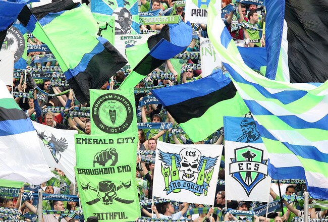 SEATTLE - JUNE 05:  Fans of the Seattle Sounders FC hold signs during team introductions prior to the game against the New England Revolution on June 5, 2010 at Qwest Field in Seattle, Washington. The Sounders defeated the Revolution 3-0. (Photo by Otto Greule Jr/Getty Images)