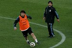 PRETORIA, SOUTH AFRICA - JUNE 06:  Argentina's head coach Diego Maradona watches on as Lionel Messi looks to pass during a team training session on June 6, 2010 in Pretoria, South Africa.  (Photo by Chris McGrath/Getty Images)