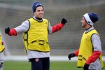 ST ALBANS, ENGLAND - NOVEMBER 23:  Cesc Fabregas (L) captain of Arsenal warms up with team mate Carlos Vela during an Arsenal training session at London Colney on November 23, 2009 in St Albans, England.  (Photo by Shaun Botterill/Getty Images)