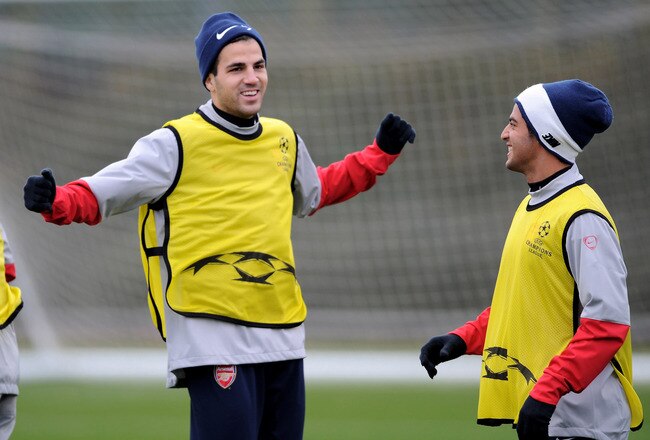 ST ALBANS, ENGLAND - NOVEMBER 23:  Cesc Fabregas (L) captain of Arsenal warms up with team mate Carlos Vela during an Arsenal training session at London Colney on November 23, 2009 in St Albans, England.  (Photo by Shaun Botterill/Getty Images)