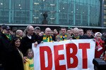 MANCHESTER, ENGLAND - JANUARY 23:  Manchester United fans, wearing green and gold scarves, protest against the Glazers, current owners of Manchester United before the Barclays Premier League match between Manchester United and Hull City at Old Trafford on January 23, 2010 in Manchester, England.  (Photo by Julian Finney/Getty Images)