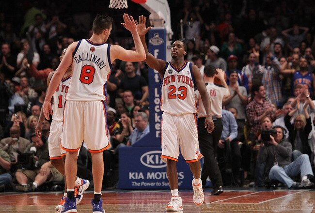 NEW YORK - MARCH 19: Toney Douglas #23 of the New York Knicks celebrates a basket with teammate Danilo Gallinari #8 against the Philadelphia 76ers at Madison Square Garden on March 19, 2010 in New York City. NOTE TO USER: User expressly acknowledges and agrees that, by downloading and or using this photograph, User is consenting to the terms and conditions of the Getty Images License Agreement.  (Photo by Nick Laham/Getty Images)