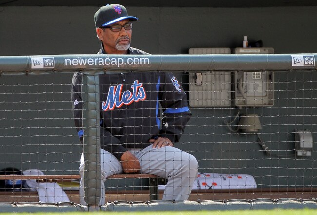 DENVER - APRIL 15:  Manager Jerry Manuel #42 of the New York Mets watches the action from the dugout against of the Colorado Rockies at Coors Field on April 15, 2010 in Denver, Colorado. All the players in MLB wore #42 today in honor of Jackie Robinson Day. The Mets defeated the Rockies 5-0.  (Photo by Doug Pensinger/Getty Images)