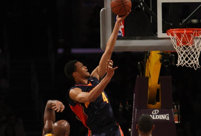 LOS ANGELES - NOVEMBER 15:  Anthony Randolph #4 of the Golden State Warriors shoots over Lamar Odom #7 and Andrew Bynum #16 of the Los Angeles Lakers on December 29, 2009 at Staples Center in Los Angeles, California.  NOTE TO USER: User expressly acknowledges and agrees that, by downloading and/or using this Photograph, user is consenting to the terms and conditions of the Getty Images License Agreement.   (Photo by Stephen Dunn/Getty Images)