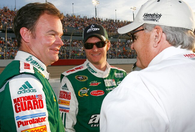 DARLINGTON, SC - MAY 08:  Dale Earnhardt Jr., driver of the #88 AMP Energy / National Guard Chevrolet, talks with crew chief Lance McGrew (L) and team owner Rick Hendrick (R) on the grid prior to the start of the NASCAR Sprint Cup series SHOWTIME Southern 500 at Darlington Raceway on May 8, 2010 in Darlington, South Carolina.  (Photo by Jason Smith/Getty Images)