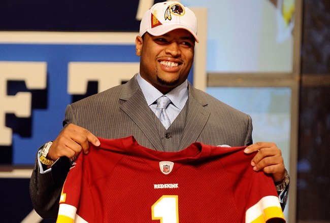 NEW YORK - APRIL 22:  Trent Williams from the Oklahoma Sooners holds a Washington Redskins jersey after Washington selected Williams number 4 overall during the first round of the 2010 NFL Draft at Radio City Music Hall on April 22, 2010 in New York City.  (Photo by Jeff Zelevansky/Getty Images)
